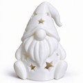 Christmas gnome made of resin with star pattern for LED tea lights