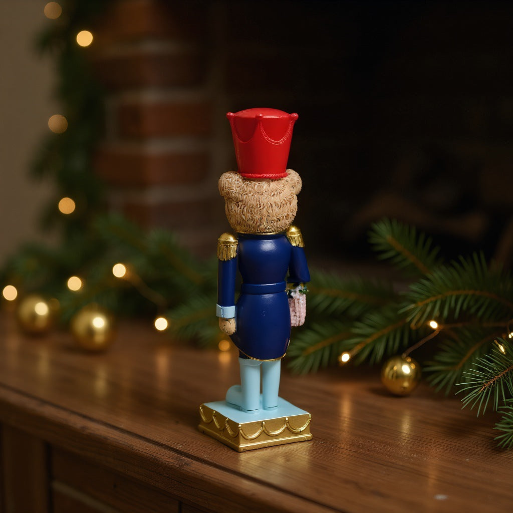 Decorative nutcracker figure with bear, synthetic resin