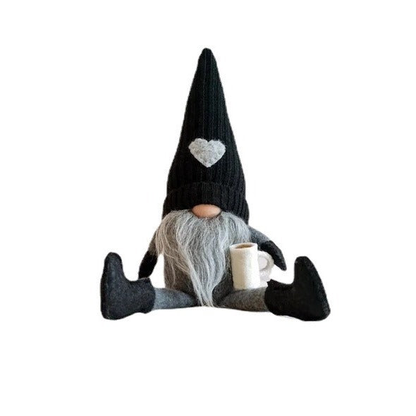Decorative gnome with coffee cup