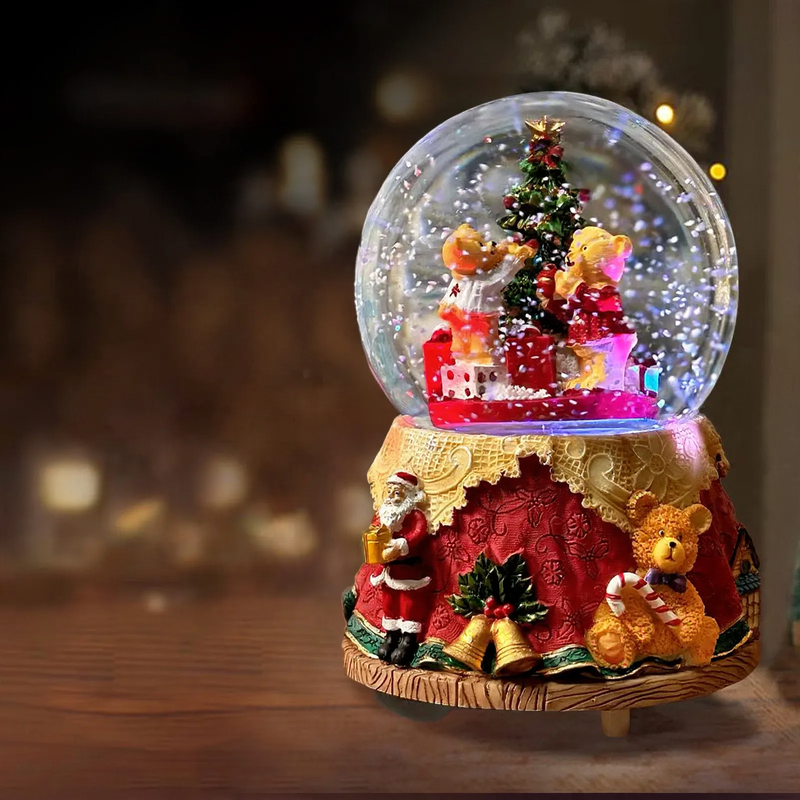 Decorative music box with snow globe motif