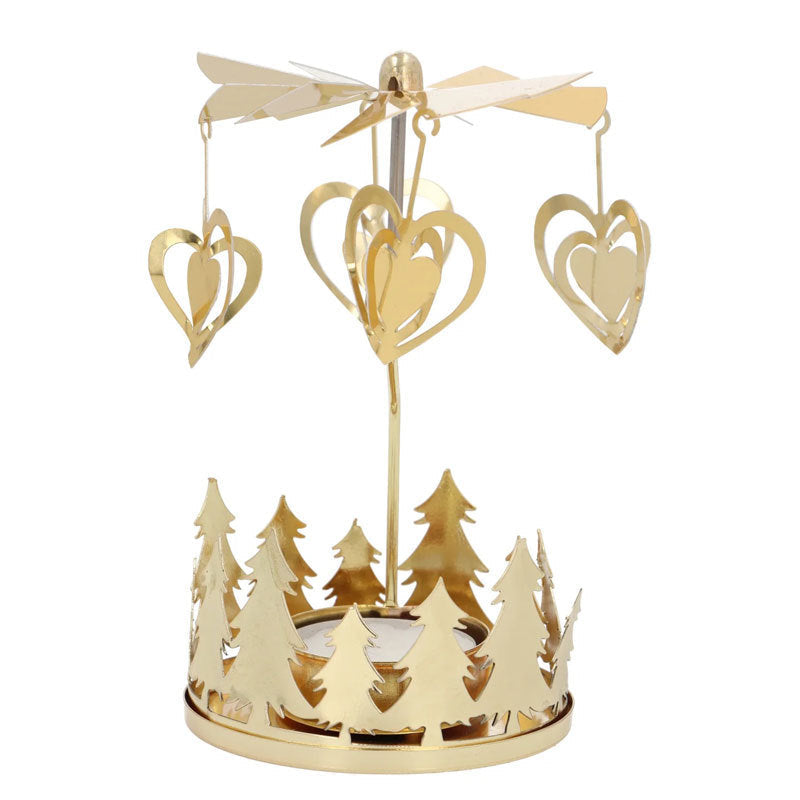 Rotating tea light holder made of brass with star motif