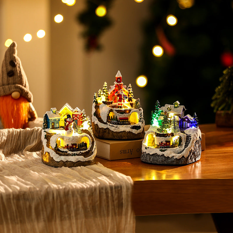 Illuminated Christmas village scene with snowman Yeouu