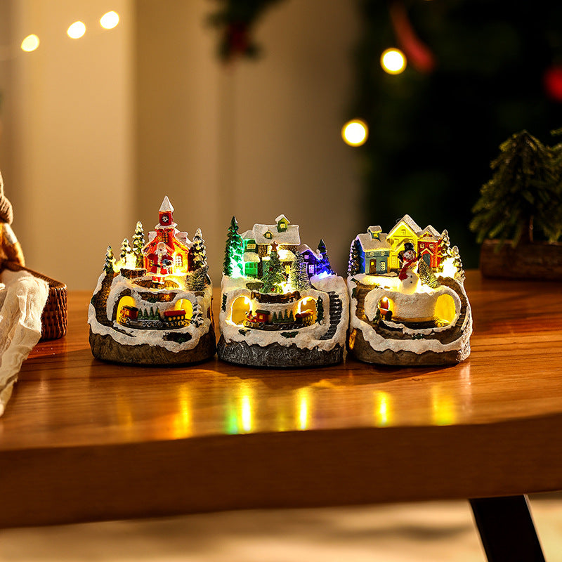Illuminated Christmas village scene with snowman Yeouu