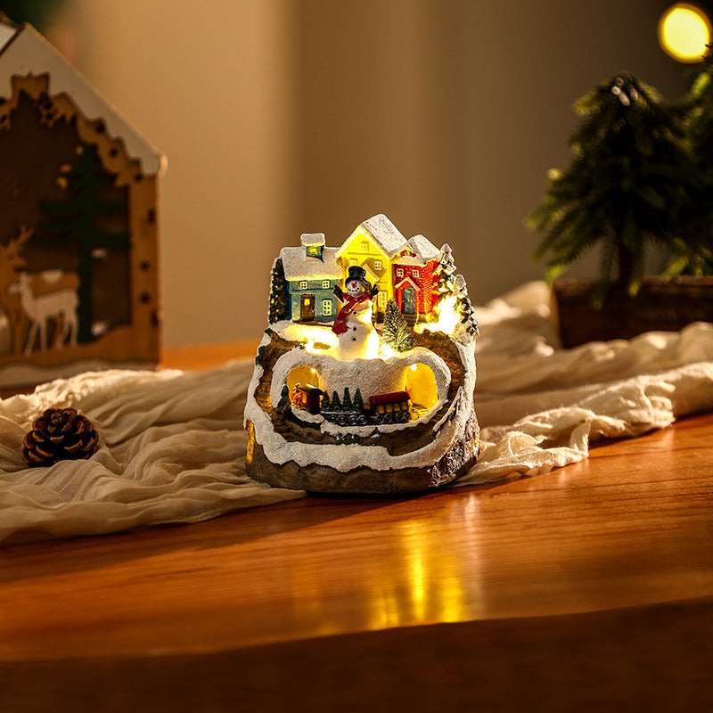 Illuminated Christmas village scene with snowman Yeouu
