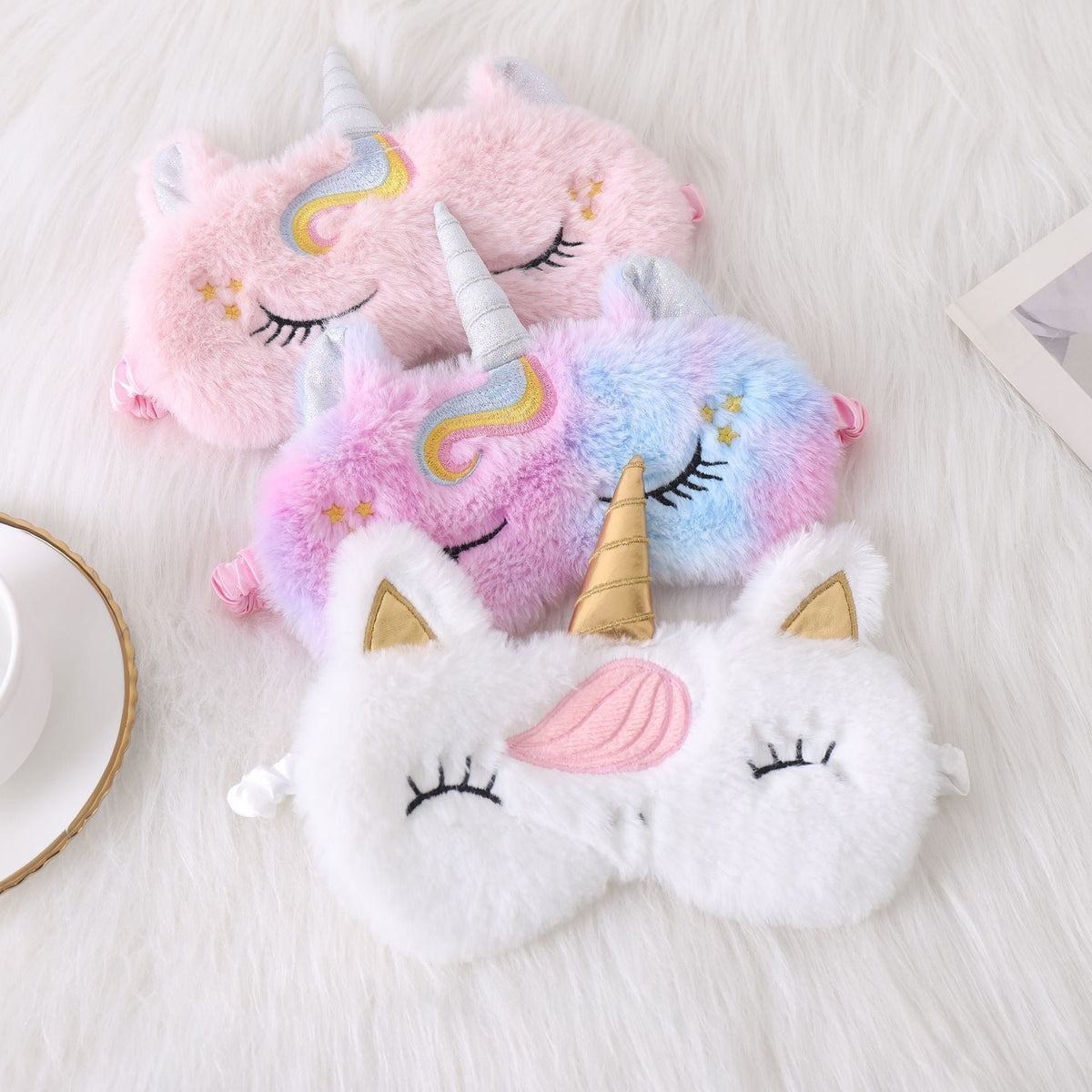 Ladies nan cozy unicorn sleep mask with embroidered eyelashes, soft plush and elastic ruffled ribbon 
Maetiva