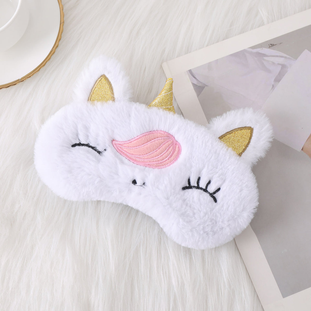 Ladies nan cozy unicorn sleep mask with embroidered eyelashes, soft plush and elastic ruffled ribbon 
Maetiva