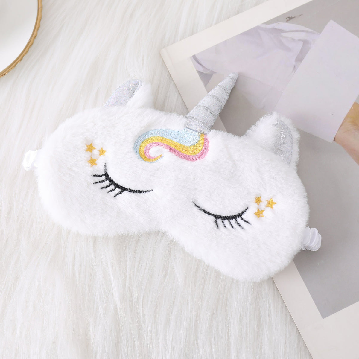 Ladies nan cozy unicorn sleep mask with embroidered eyelashes, soft plush and elastic ruffled ribbon 
Maetiva